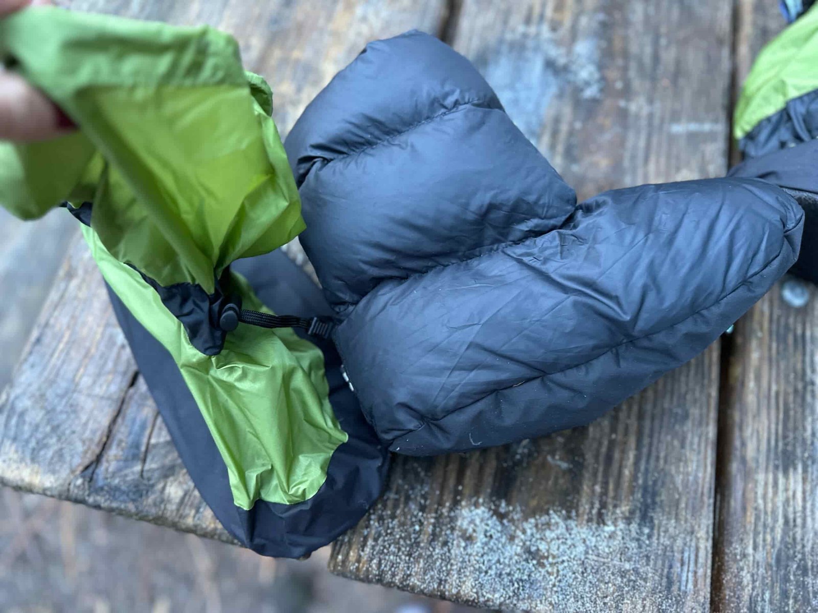 a green down bootie at camp