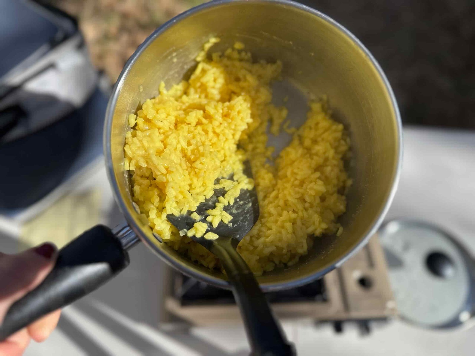 a pot of risotto after being cooked on a camp stove