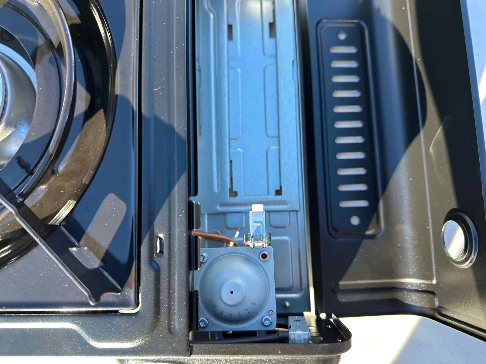 close ups of the Coleman Classic 1-Burner Butane Camping Stove in an camp site in the pines