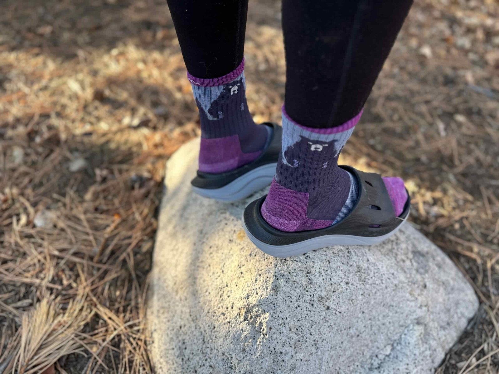 a woman wears the HOKA ORA Recovery 3 Slides to show off the fit of the shoe