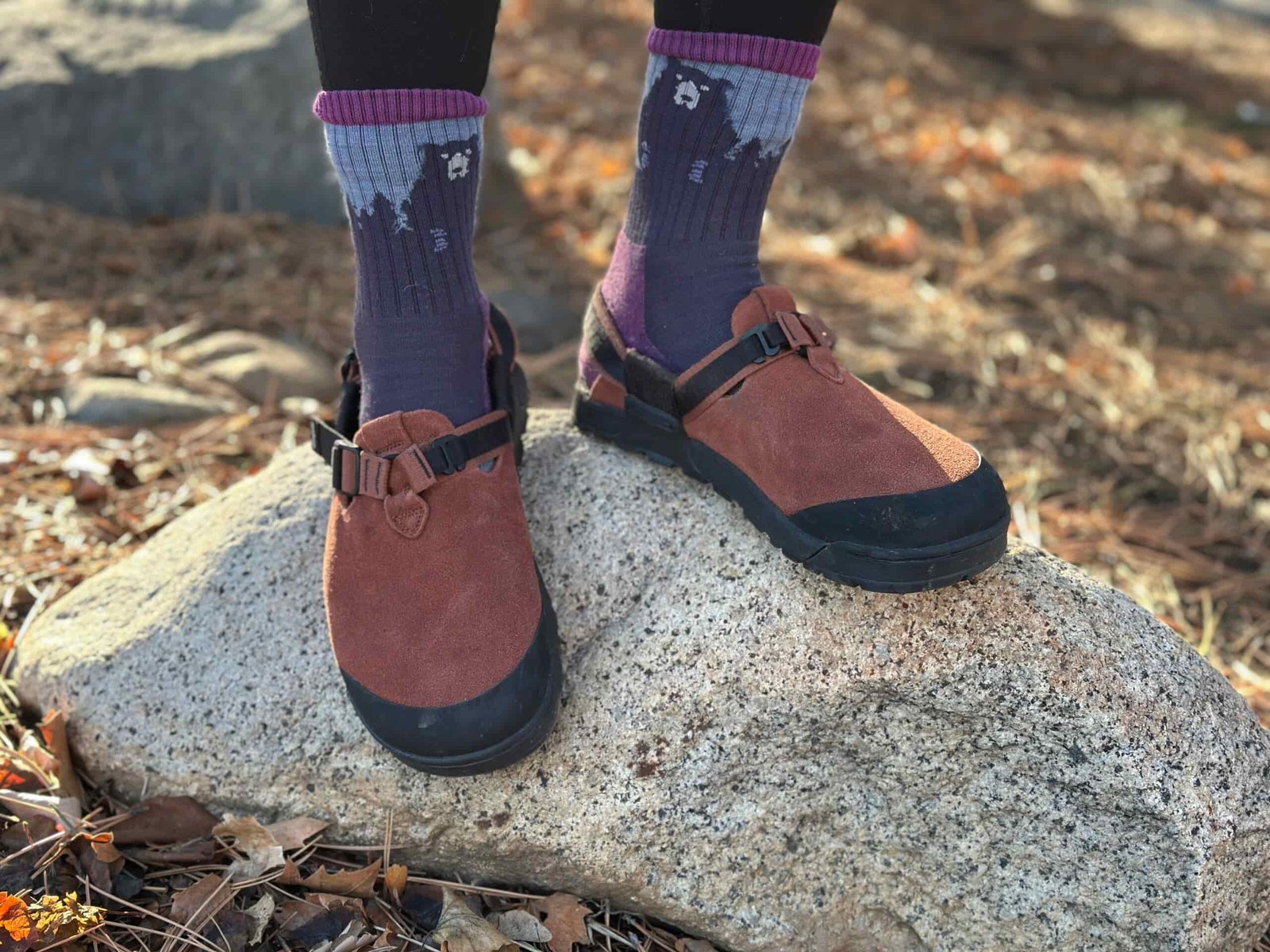 a woman shoes off the traction of the Bedrock Mountain Clog