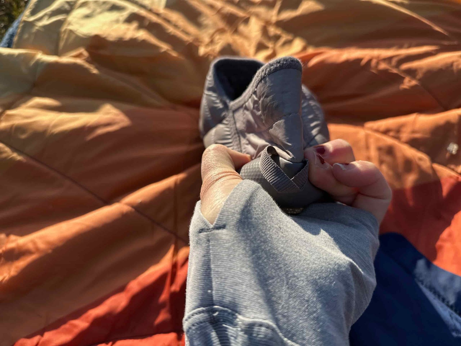 The bend squeeze twist tests The North Face ThermoBall Traction Mules V
