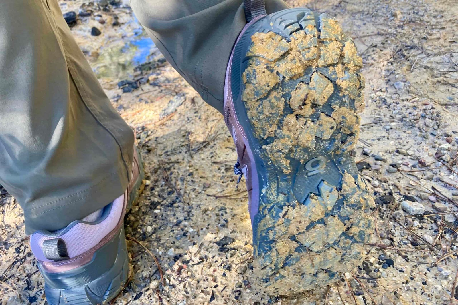 Close-up showing how the Oboz shoes shed thick mud without caking between the grooves in the bottom of the shoe.