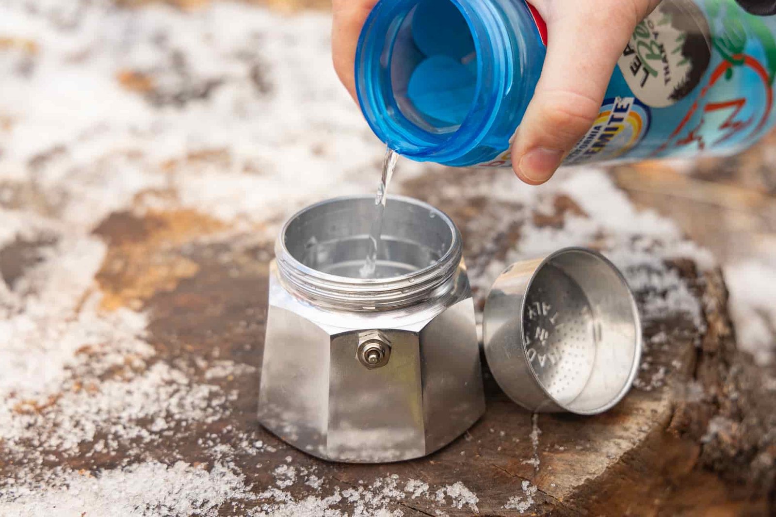 Pouring water into the base of the Bialetti Moka Express.