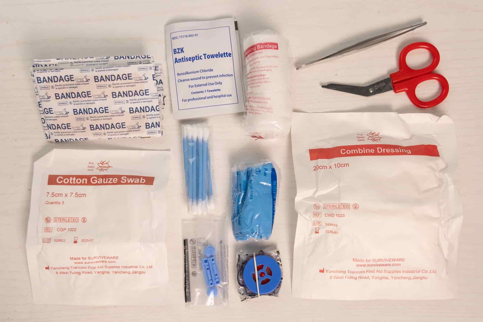Most of the first aid supplies in the Surviveware Small.