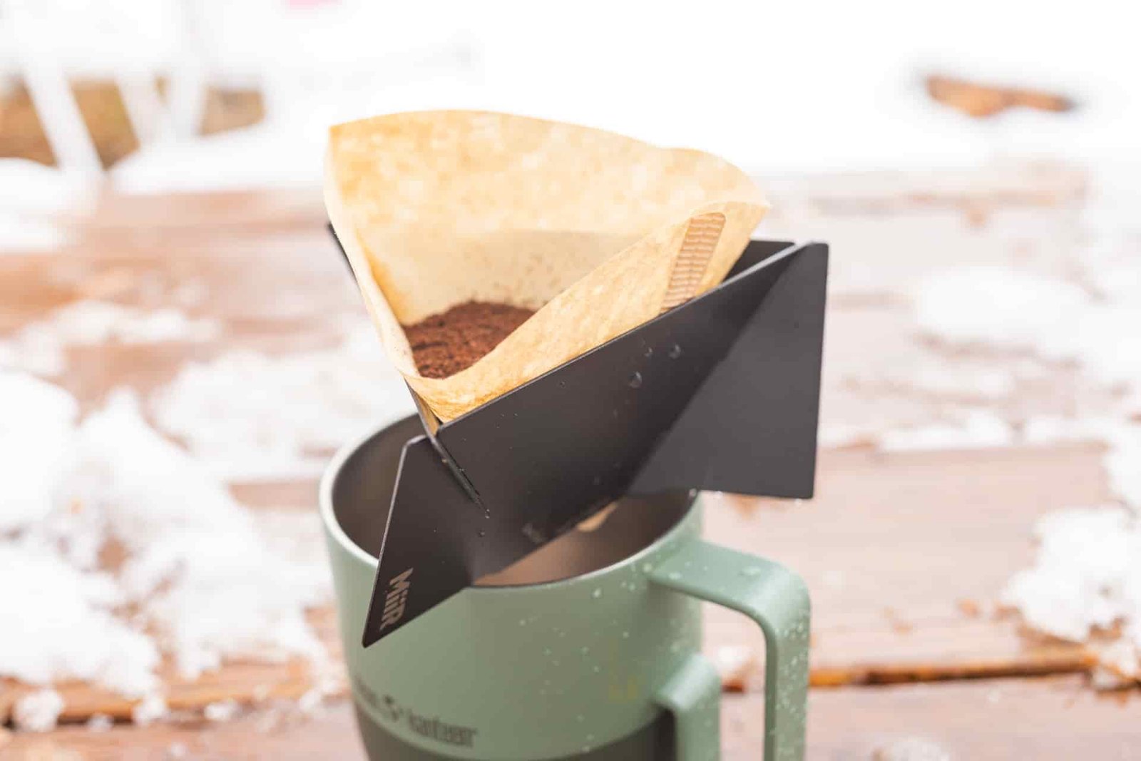 Dry coffee grounds in a filter in the MiiR Pourigami.