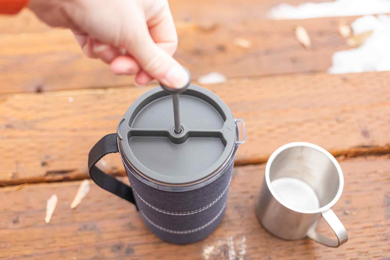 A hand depressed the plunger on a GSI Java Press.