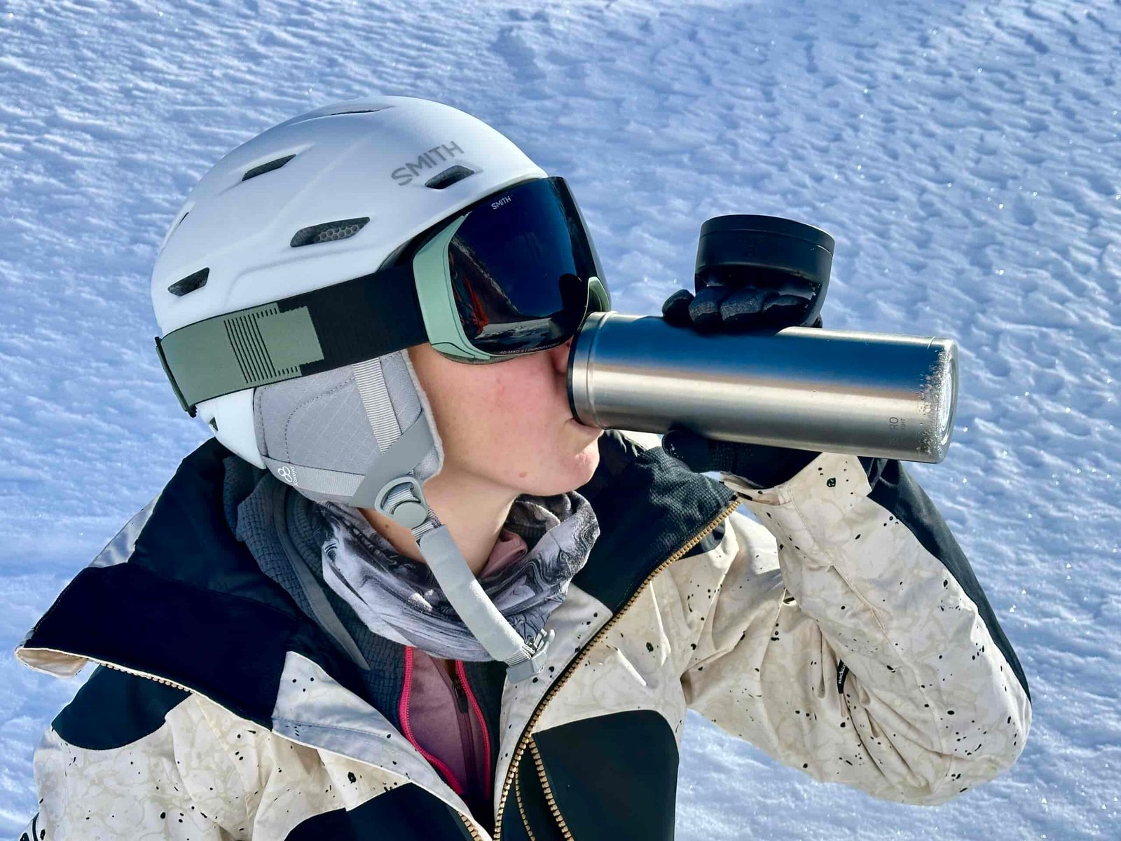 A woman drinks from an ESPRO bottle.
