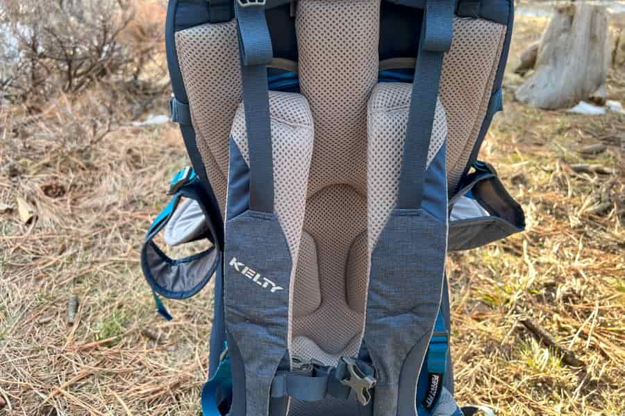 Rear view of the baby carrier highlighting breathable mesh padding and ergonomic strap design.