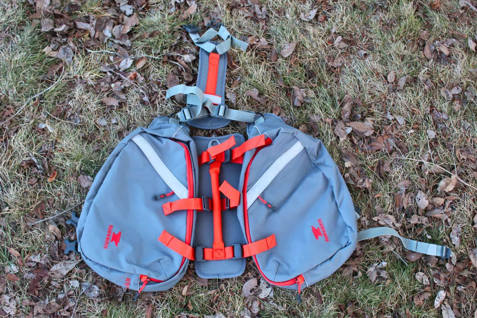 The Mountainsmith K9 Dog Backpack laid out on the ground