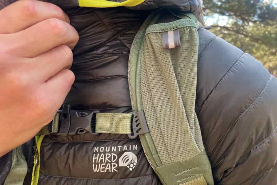 A close-up of the shoulder strap and chest buckle on the Osprey Poco Premium, emphasizing its durable build and secure fit.