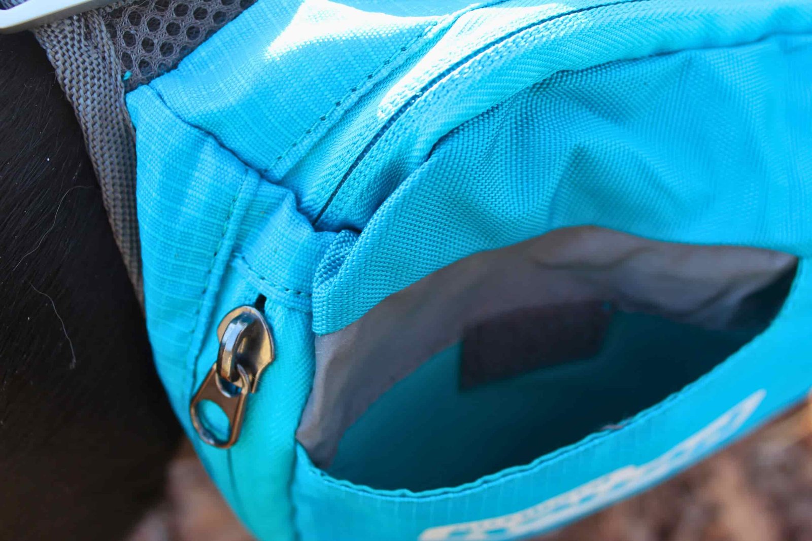 Close up of the outer pocket and zipper of the Outward Hound DayPak