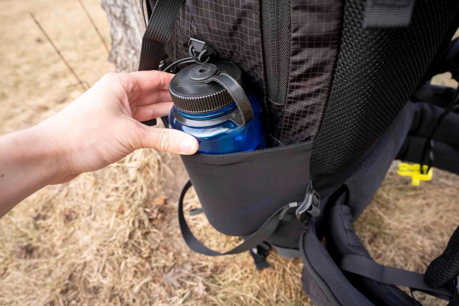 water bottle in side pocket of backpack