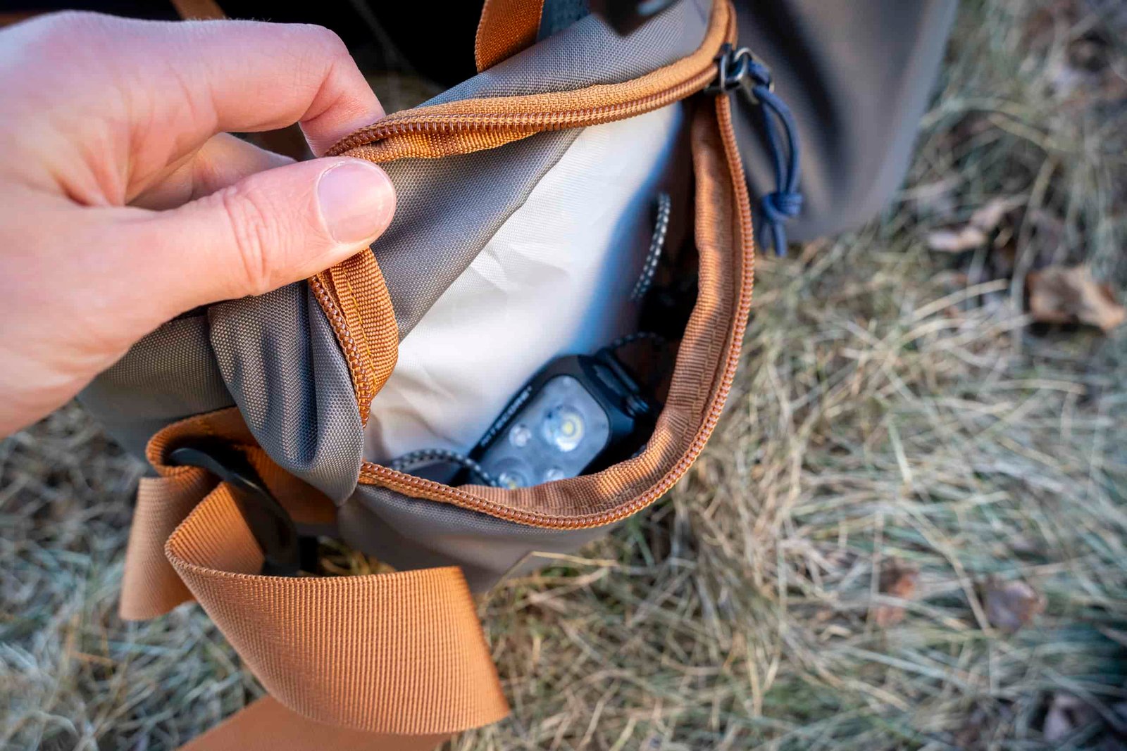 hipbelt holding headlamp on backpack