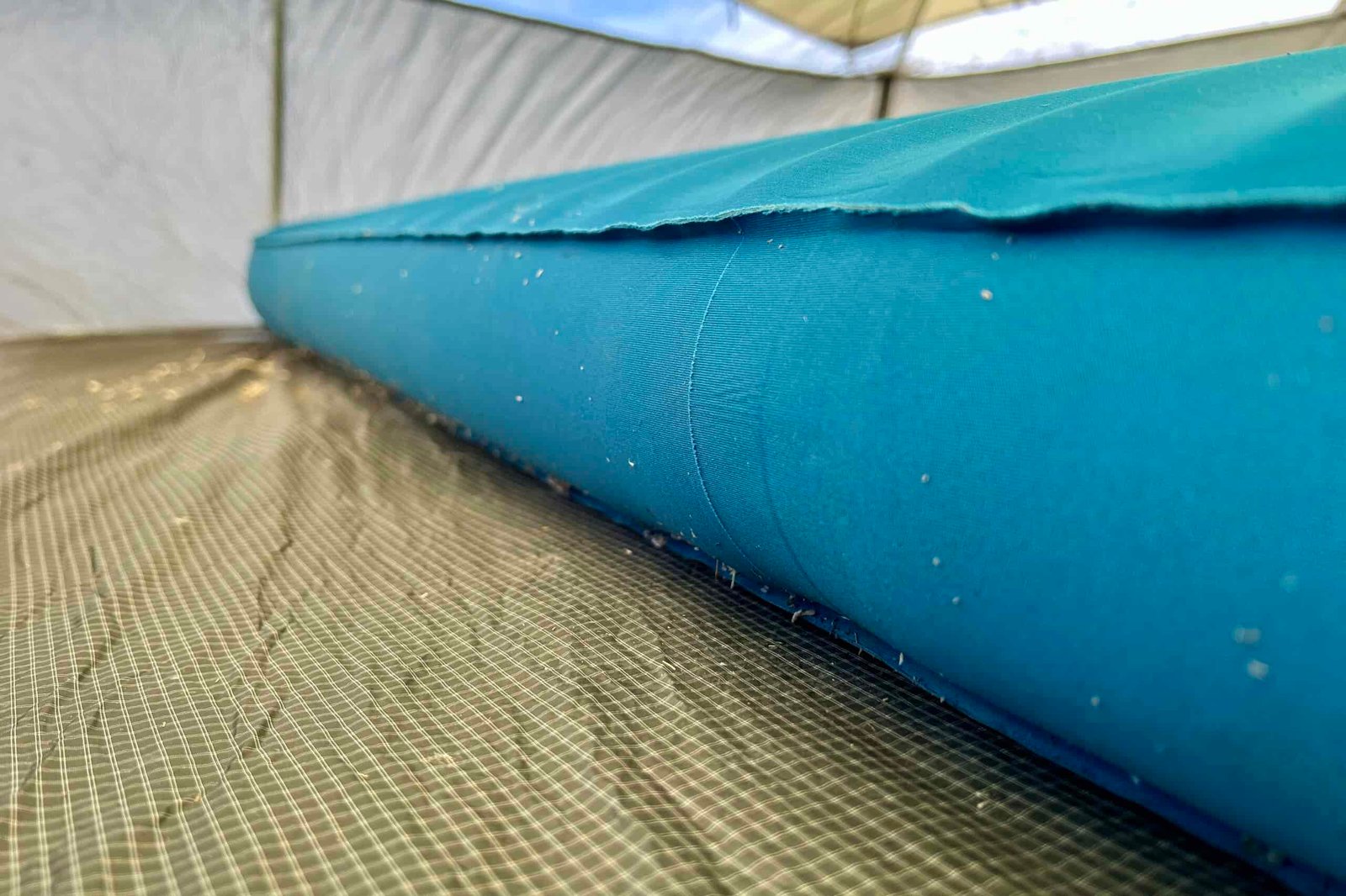 Close-up image of a camping mattress's thick side profile.