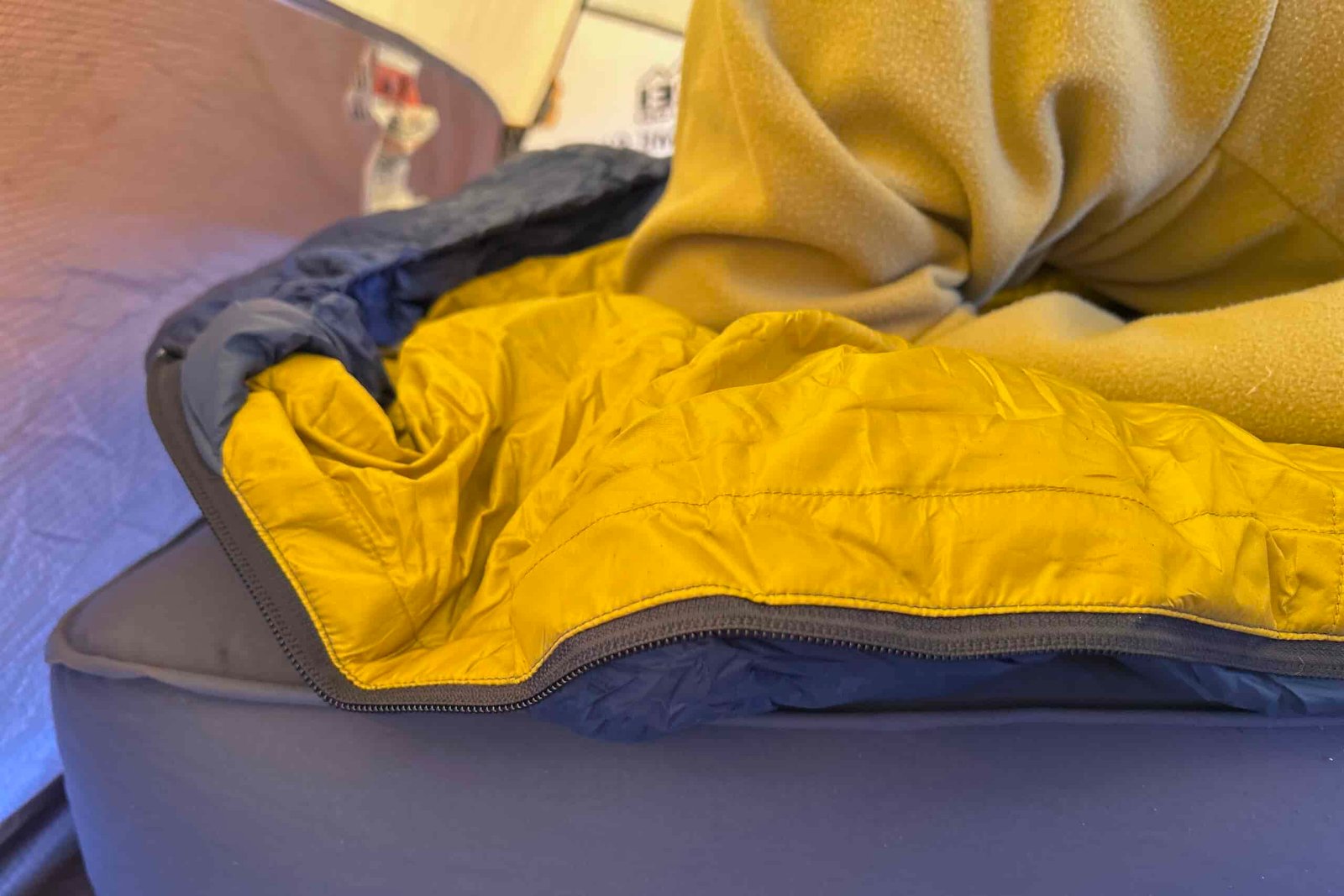 Close-up shot of the side of a sleeping bag showing off it's cushy fabric.