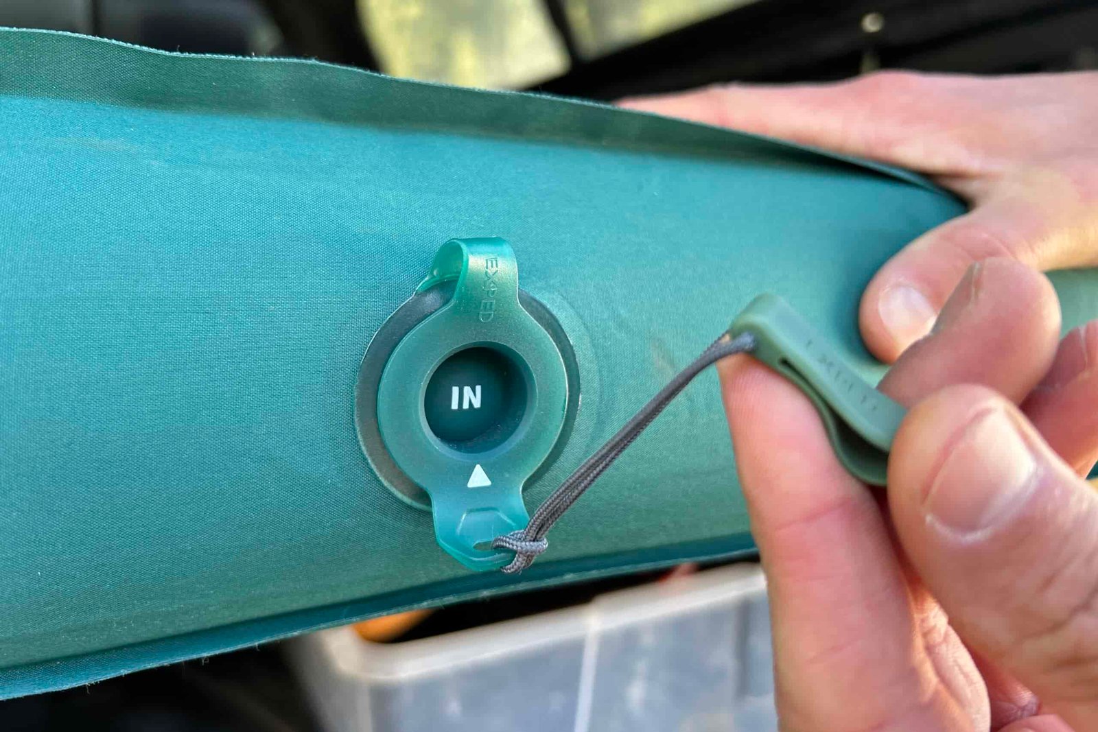Close-up image of the inflation valve on a camping mattress.