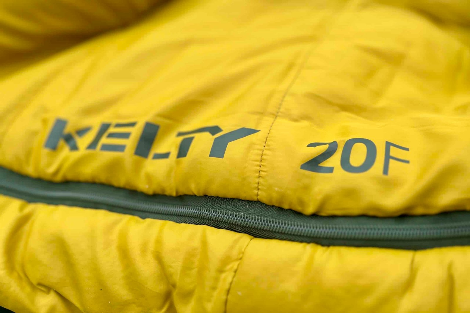 Close-up image of a sleeping bag with the brand's logo and temperature rating visible.