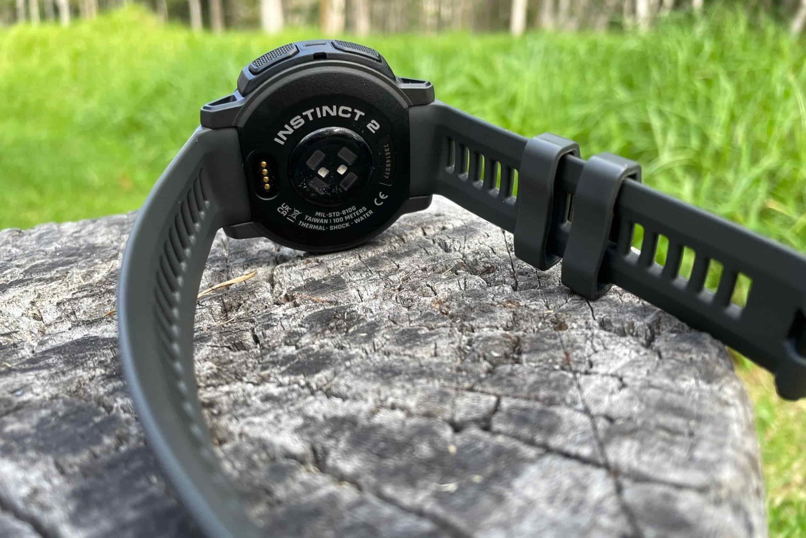 A closeup of the underside of a GPS watch.