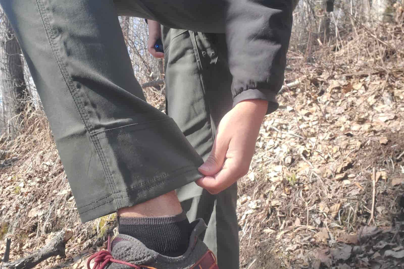 A close up of the hems of a pair of hiking pants.