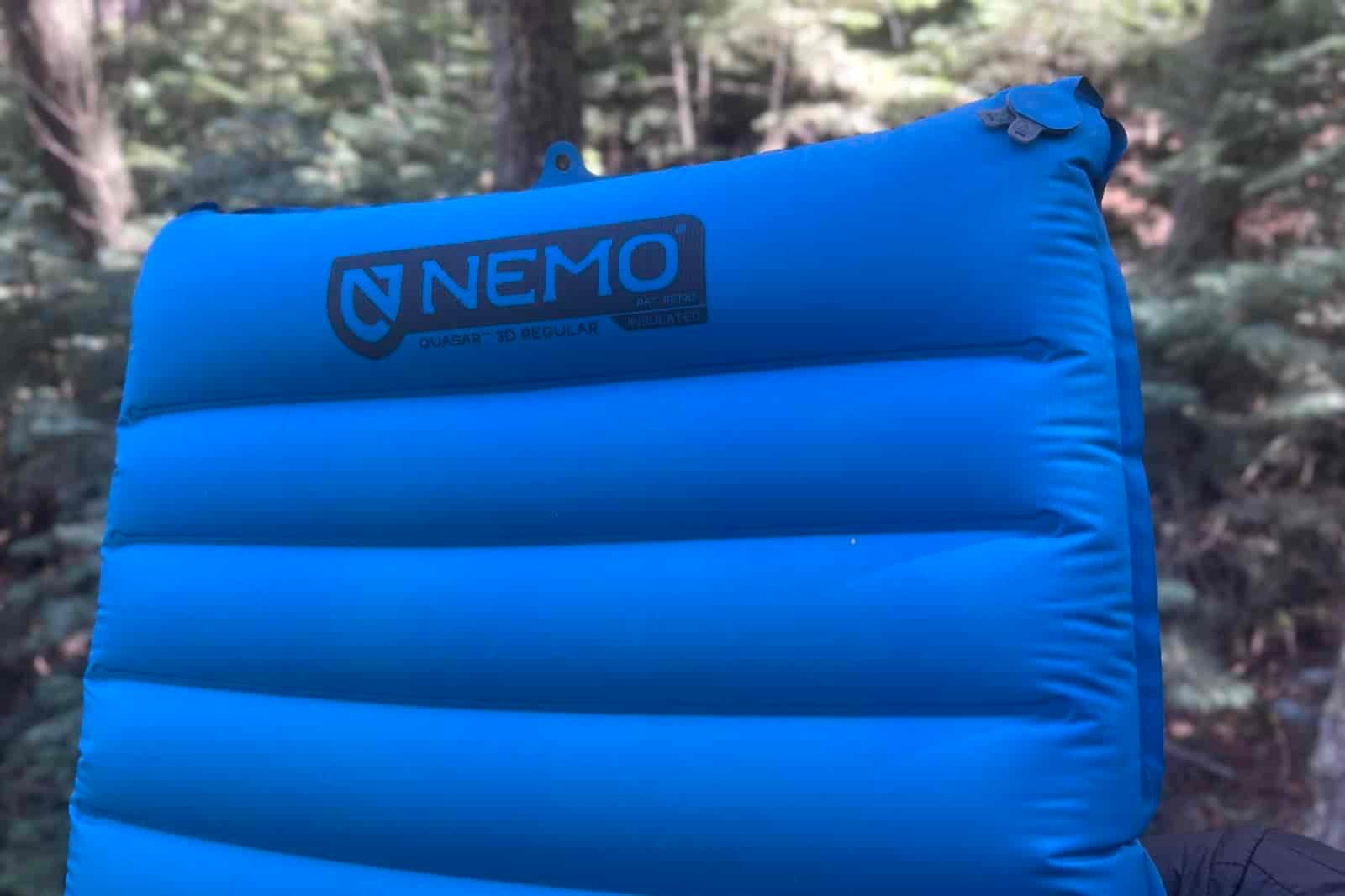 a closeup of the top of a blue sleeping pad