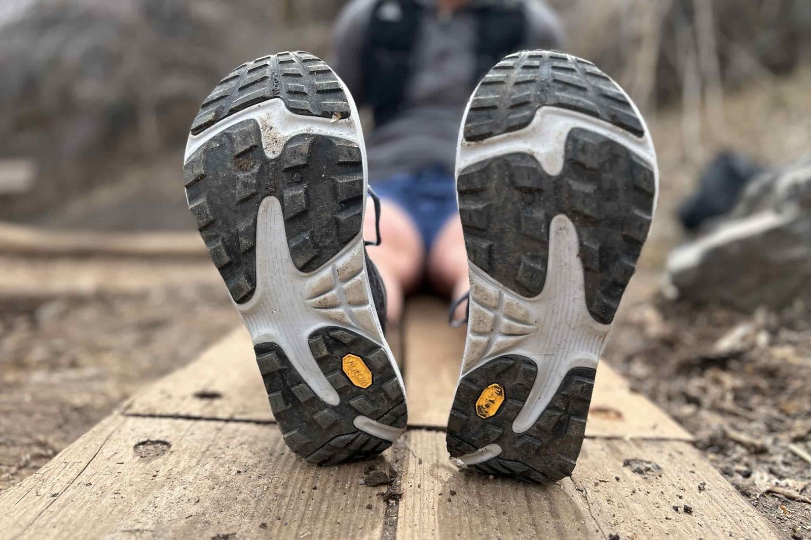 Image of the bottom of a pair of trail runners, showing off the tread.