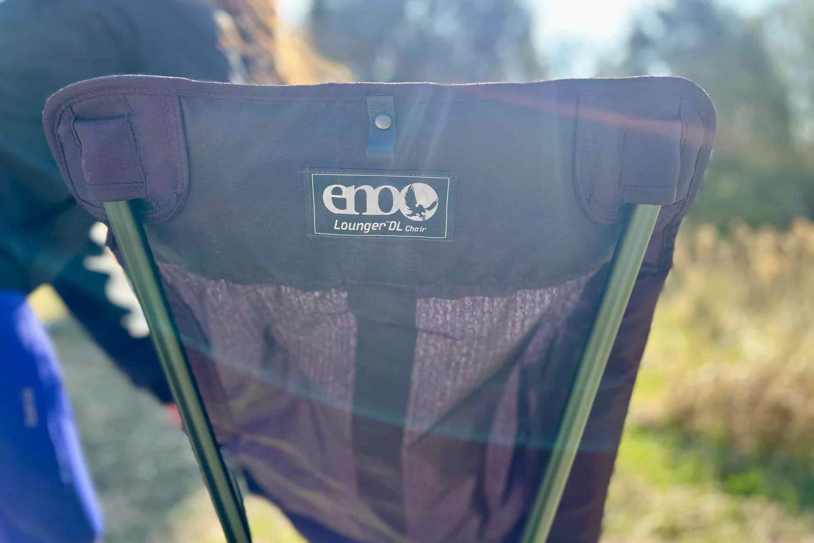 Close up of the back of a camping chair with the logo visible.