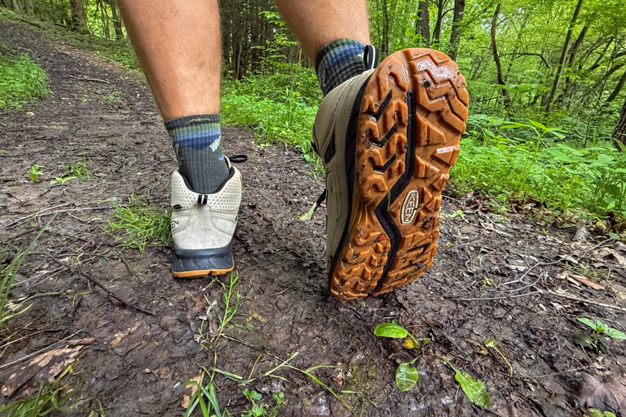 Back of Keen Hightrail Mid boots showing mud-splattered heel and outsole.