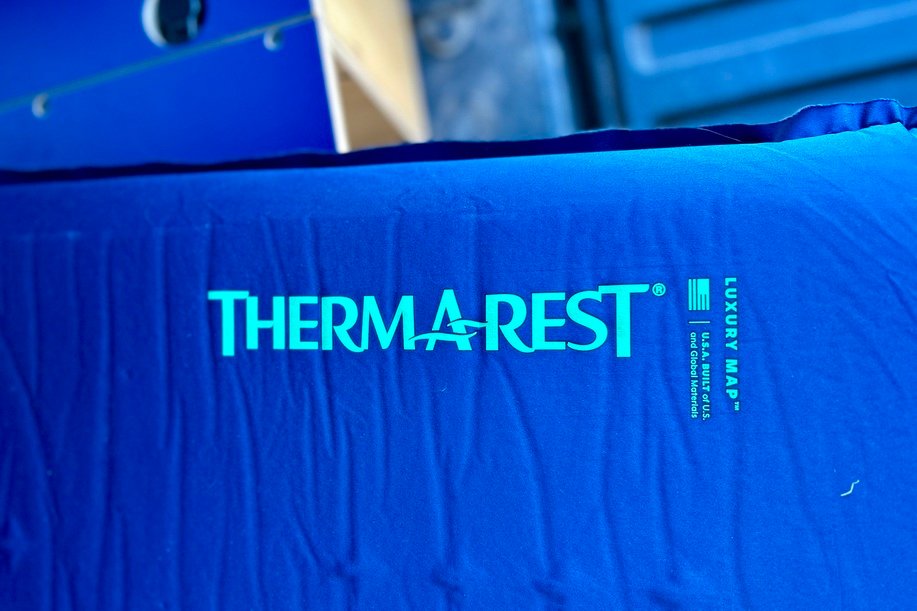 Close up image of a camping mattress with brand name decals visible.