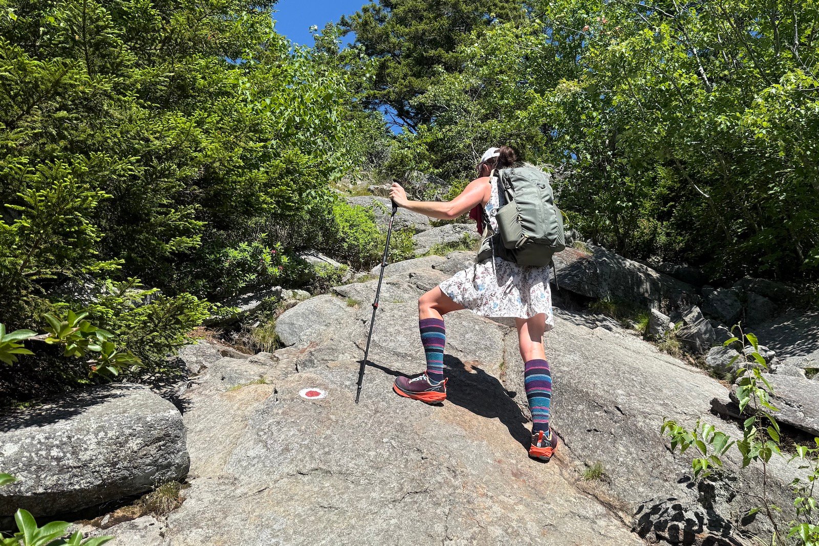 Hiker in the Altra Experience Wild 2 climbing Mount Monadnock, NH