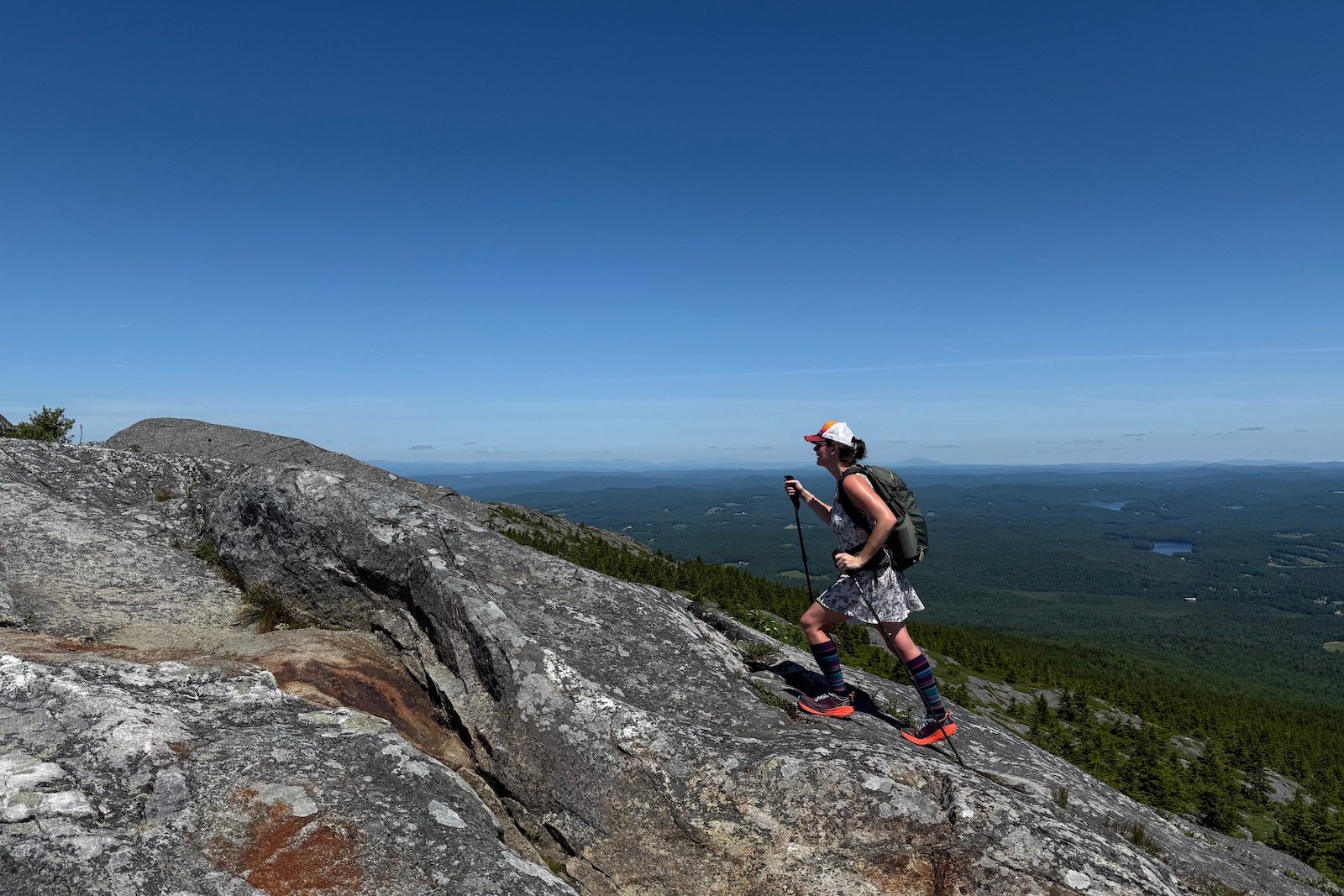 Hiker in the Altra Experience Wild 2 climbing Mount Monadnock, NH