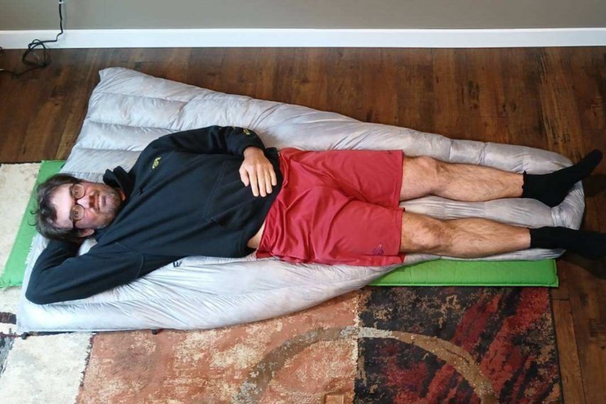 Hyperlite Mountain Gear 20-Degree Quilt with a person for scale