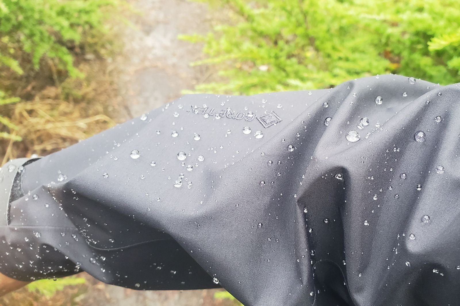 A closeup of water droplets on a rain jacket