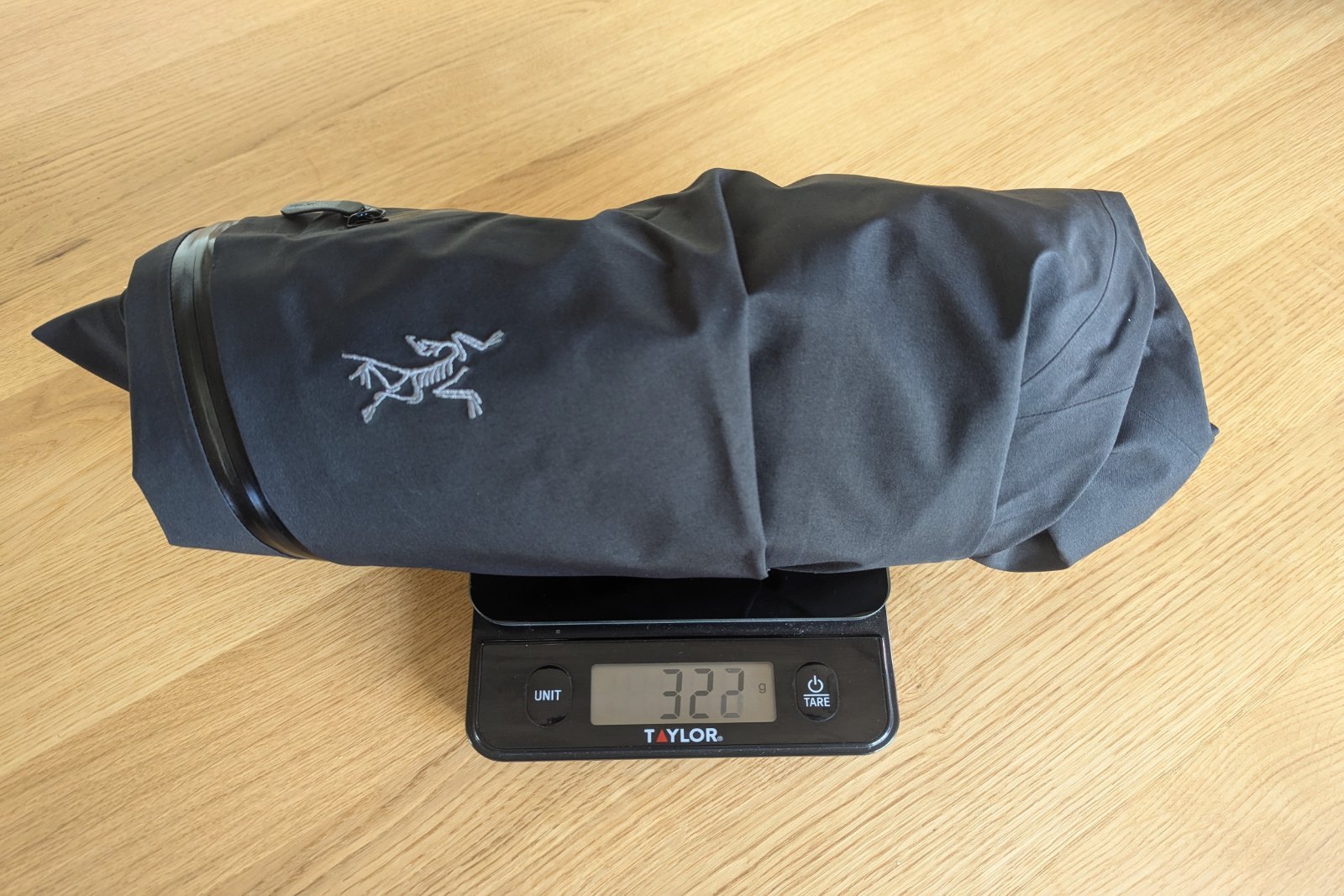 Weighing the Arc'teryx Beta Pants on a small kitchen scale.