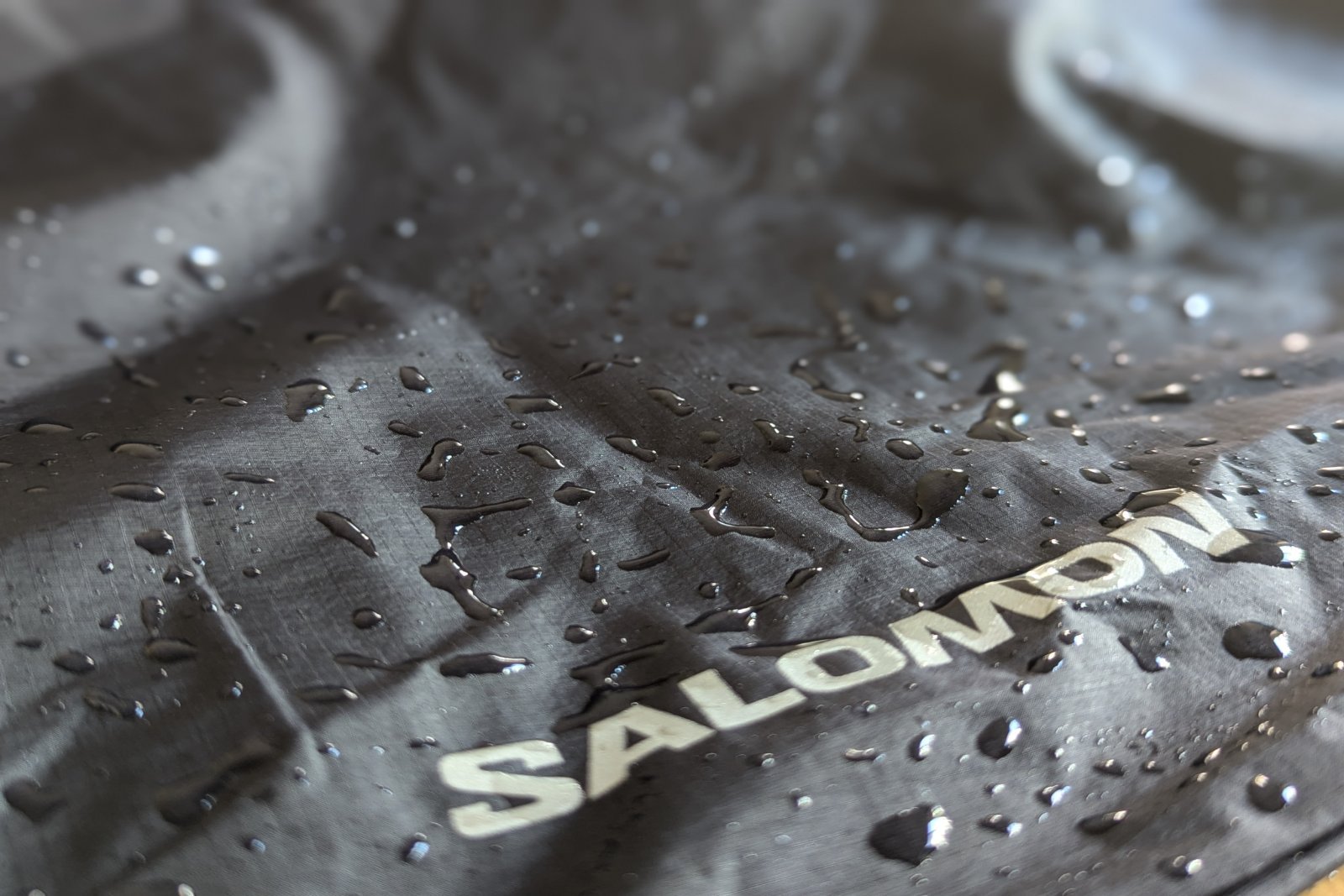 Water beaded on the fabric of the Salomon Bonatti rain pants.